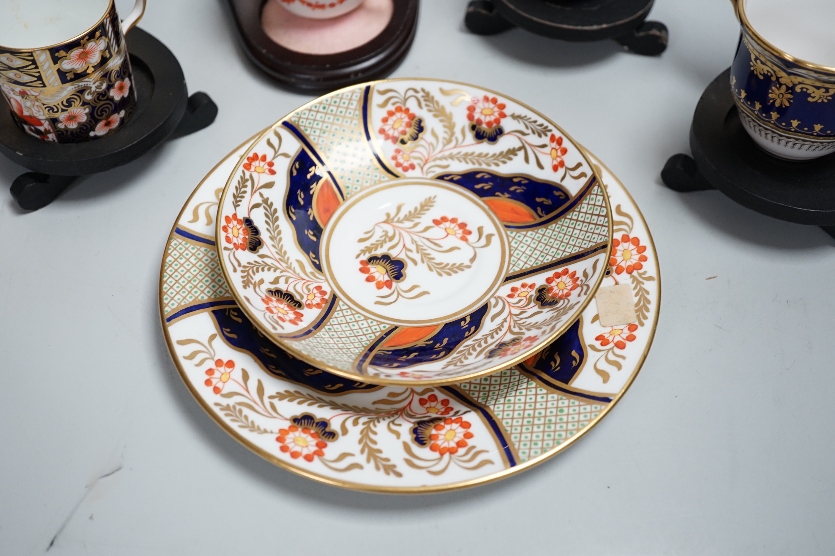 Three pairs of Royal Crown Derby porcelain cups and saucers, another Spode and a Victorian trio